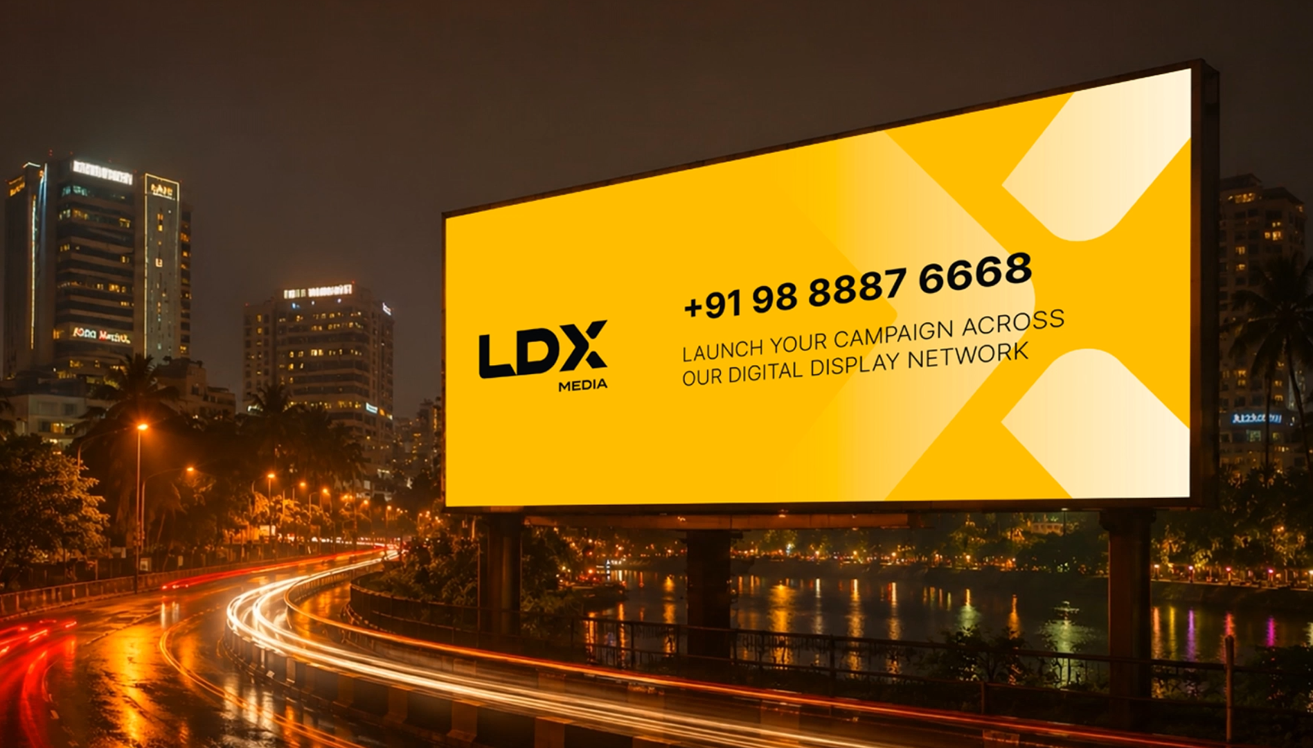 An LDX digital billboard lighting up a city road at night